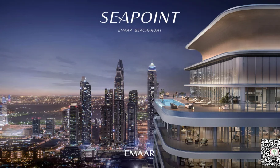 The image showcases a contemporary high-rise building with an opulent balcony that offers breathtaking views of the cityscape at dusk. The skyline is adorned with illuminated skyscrapers and a standout tower, while a QR code is subtly placed on the lower right corner. The elegant text Seapoint Residences Emaar Beachfront appears prominently above. For those seeking premium properties in Dubai, Redlac Real Estate offers an exceptional portfolio, providing you access to stunning residences like these to elevate your lifestyle in one of the worlds most vibrant cities.