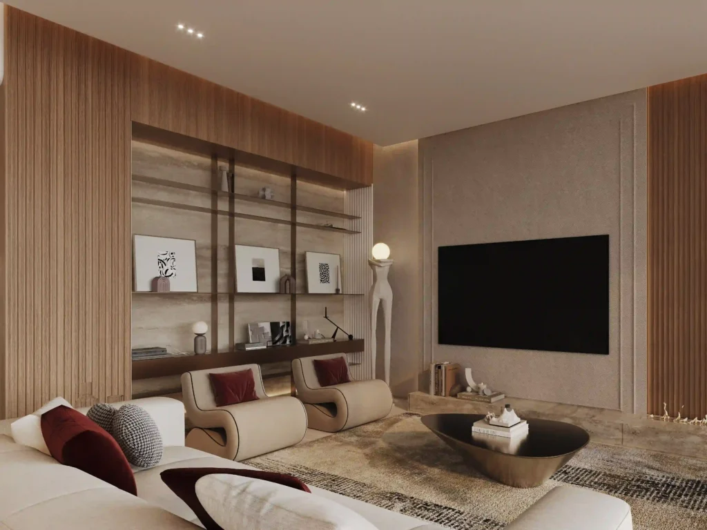 Discover the elegance of a Binghatti Ruby-inspired living room with Redlac Real Estate in Dubai. This exquisite space harmonizes beige and wooden tones, featuring a large flat-screen TV on the right, two inviting beige chairs accented by red cushions, a sleek low coffee table, and stylish shelves adorned with decorative items on the left. Soft lighting elevates the cozy ambiance for an unparalleled living experience.