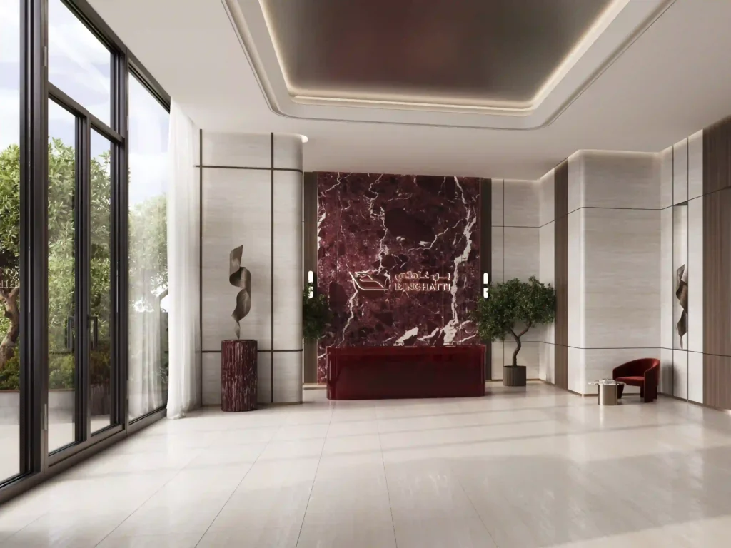 Step into luxury at this elegant hotel lobby, showcasing a stunning maroon marble accent wall adorned with the Park Hyatt logo. Modern sculptures and expansive floor-to-ceiling windows enhance its allure, reminiscent of a Binghatti Ruby design. Enjoy a sophisticated seating area and sleek white flooring in this bright, minimalistic space. Discover such luxurious properties with Redlac Real Estate in Dubai.